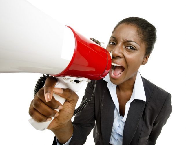 African American business woman holding megaphone isolated on wh