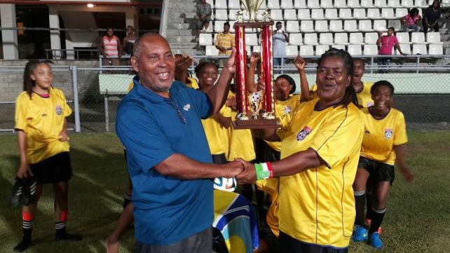 The winners receive their trophy 