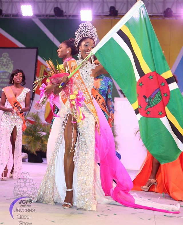 Floissac waves the flag of Dominica after winning the crown. Photo: Jaycees Queen Show