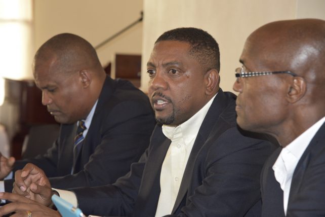 Press Briefing following the Board of Directors meeting in Roseau, Dominica – President Dave Cameron (middle) is supported by VP HE Emmanuel Nanthan (left) and head of Cricket Committee, Julian Charles (right)  