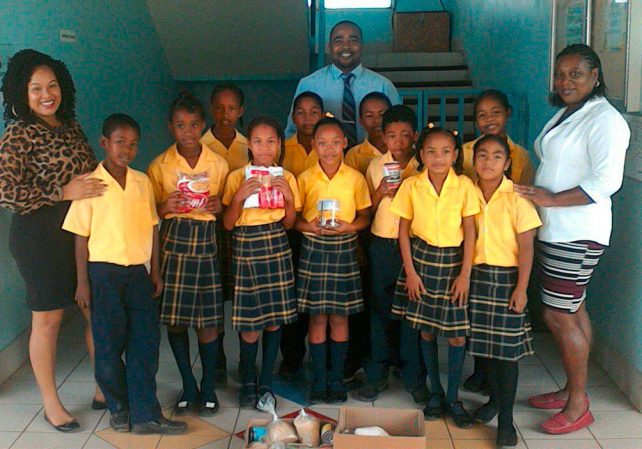 Students of the Salybia Primary School with their donation 