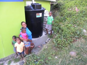 Women in four Dominican communities presented with water tanks