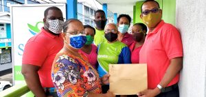 Sagicor staff makes donation to Dominica Cancer Society
