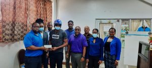 An ‘85% recovered’ Tyrone Theophile receives 17K cheque from DCA