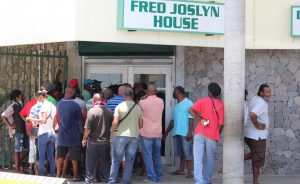 Bus drivers and taxi operators line up at DSS for stimulus cheque