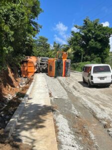 IN PICTURES: Dump truck flips on its side at Castle Bruce