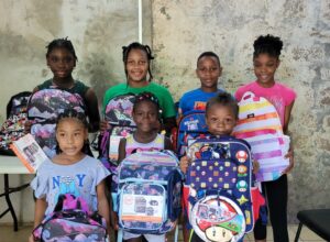 F&F International supports education with a donation to Soufriere / Scotts Head / Gallion Village Council